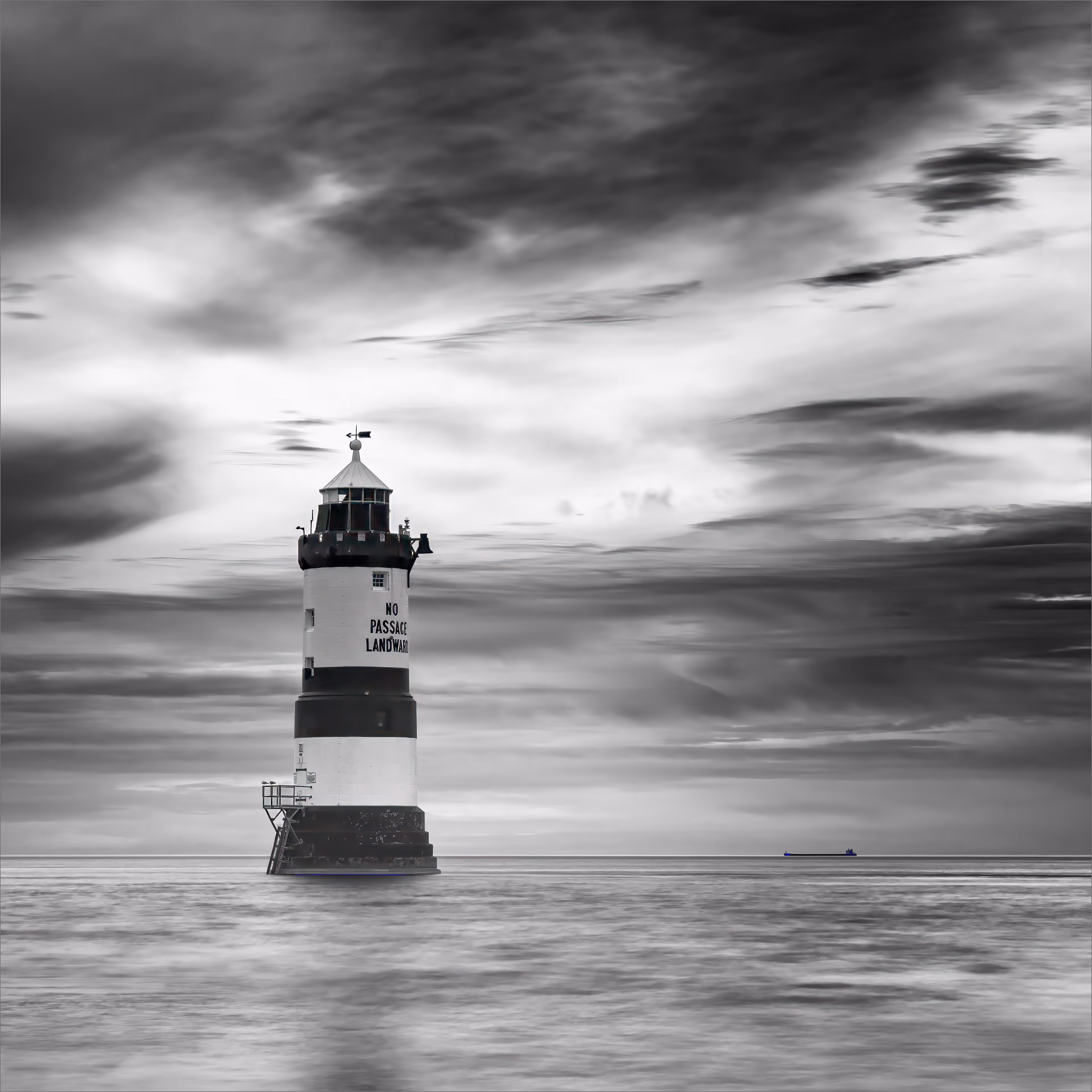 Lighthouse and Distant Ship